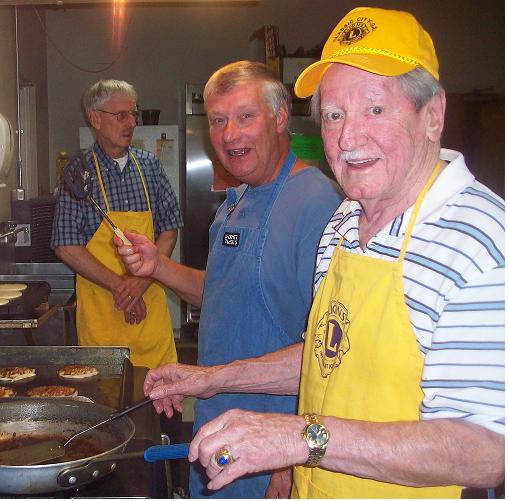 Wen, Greg and Jerry cooking the food